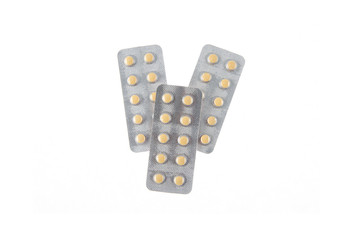 three plates of yellow pills on white isolated background