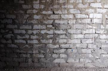 half-darkened brick wall