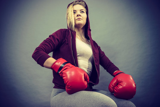 Woman wearing boxing gloves