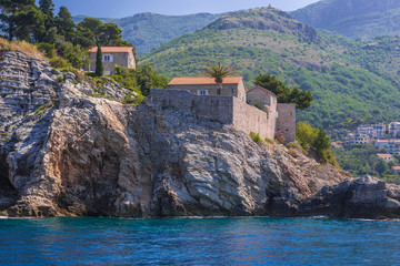 Fototapeta na wymiar Shore of Island of Sveti Stefan near Budva in Montenegro