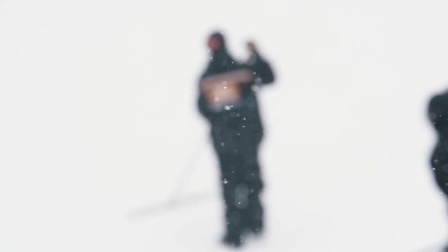 Terrain Park Workers Raking Jumps in Snow Storm
