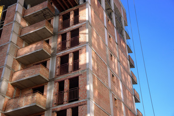 apartment building construction site on blue sky background