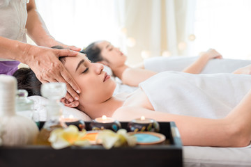 Obraz na płótnie Canvas Young healthy asian woman lying relax in spa salon.Traditional Thai oriental aromatherapy and Massage beauty treatments.Recreation vitality wellness wellbeing resort hotel lifestyle leisure