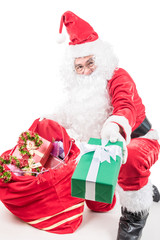 Santa Claus carrying big bag  to delivery christmas gifts isolated on white background
