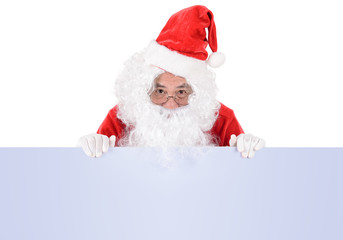 Santa Claus pointing in white blank sign with smile, isolated on white background ..copy space for Advertising christmas and happy new year festival