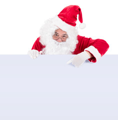 Santa Claus pointing in white blank sign with smile, isolated on white background . .copy space for Advertising christmas and happy new year festival