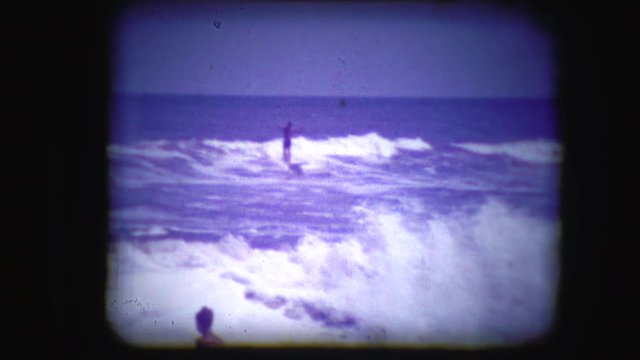Archival footage of a man surfing