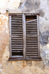 Europe, Spain, Balearic Islands, Mallorca. Wood shuttered window.