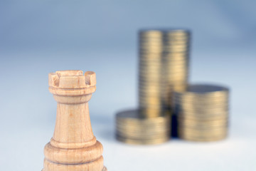 chess pieces piles of gold coins conflict management concept