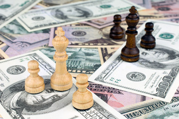 chess figures dollar bills crisis intervention concept