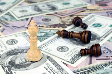 chess figures dollar bills crisis intervention concept