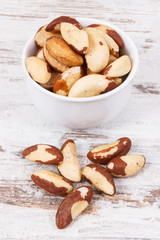 Heap of brazil nuts on rustic board
