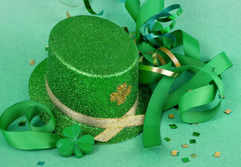 Saint Patrick's Day image of sparkly green and gold leprechaun hat with curls of green and gold...