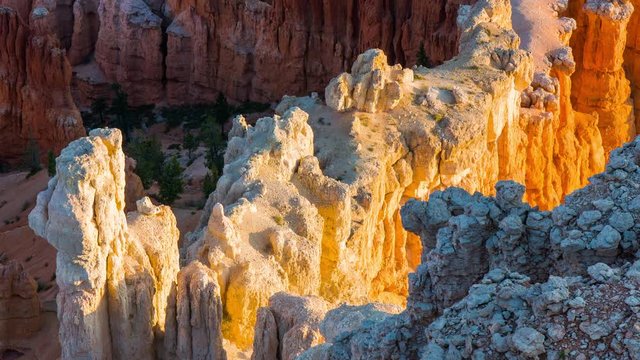 Rays of the sun illuminates orange cliffs. Spectacular view at the cliffs. Amazing mountain landscape. Nature video. Bryce Canyon National Park. Utah. USA. 4K, 3840*2160, high bit rate, UHD