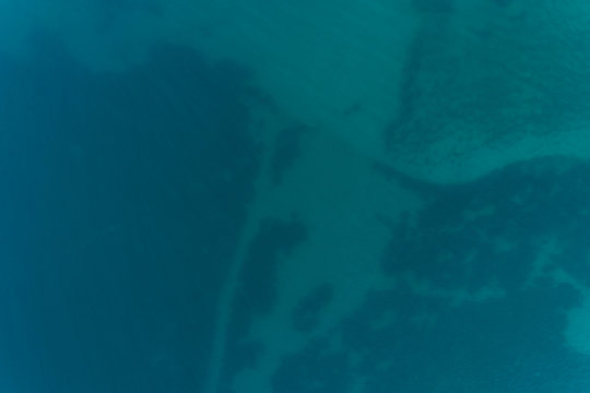 Aerial view of the rocky bottom of the Adriatic Sea covered  water