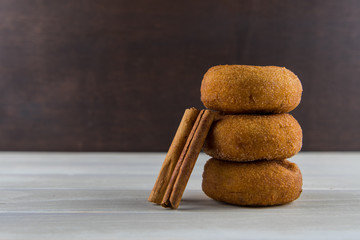 Cinnamon Sticks Leaning on Donuts