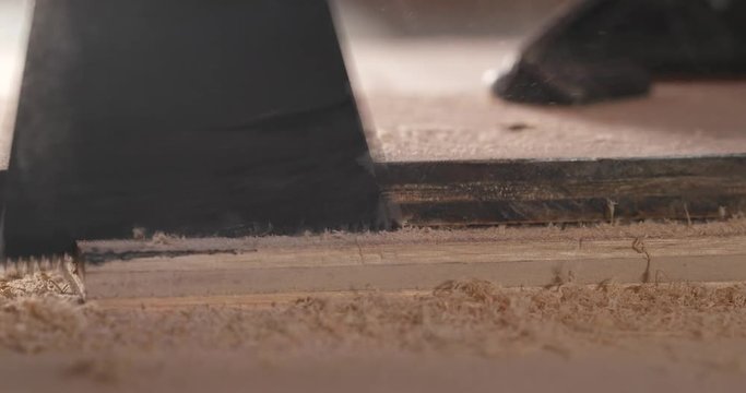 Woodworker cutting a piece of wood using a jigsaw