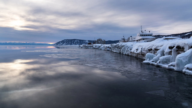 Ice-covered pier in the Baikal port village