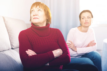 Portrait upset adult women looking away after conflict