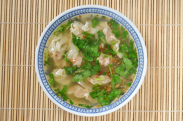 Wonton soup  in a bowl. Traditional asian food.   