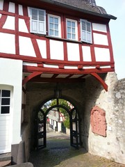 Half timbered house in Limburg with road and gate