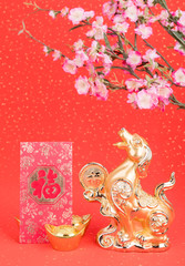 golden dog statue on red paper,translation of calligraphy: good Fortune for year of the dog,red stamp: year of the dog,2018 is year of the dog.