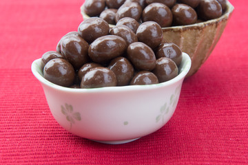 chocolate balls. chocolate balls in bowl on a background