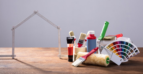 Measuring House Tape With Different Painting Equipments