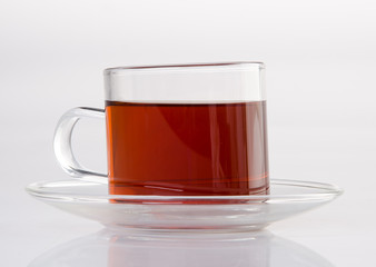 Tea in glass cup on a background. Tea in glass cup on a background