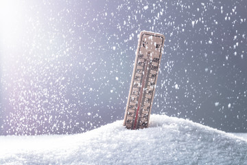 Thermometer On Snow Showing Low Temperature