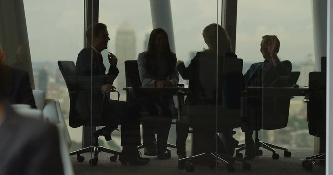 4k, Silhouette of business people in meeting. Slow motion.