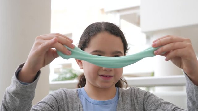 Girl with slime in her hands