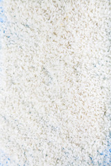 Raw rice close-up, background.