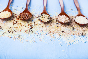 Five spoons with different grades of rice