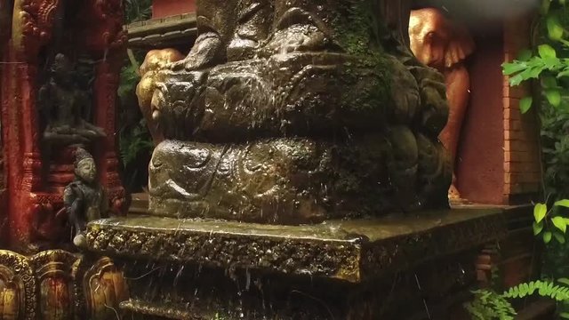 slow motion. statue fountain in asian style
