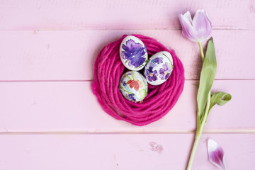Pink Easter Eggs and Tulip Flower  on a  Pink Wooden Background. Easter Decoration.  Decoupage ideas .