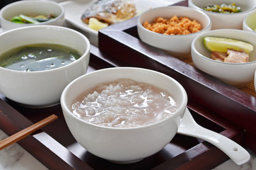 Traditional chinese rice porridge on dinner table  