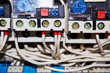 Electrical wires connected to the numbered relays. Close-up.
