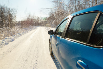 GOMEL, BELARUS - FEBRUARY 7, 2018: A car of blue color is parked on a dirt road.