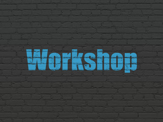 Fototapeta na wymiar Studying concept: Painted blue text Workshop on Black Brick wall background