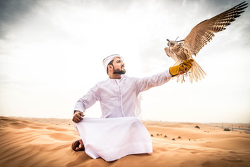 Arabic man in the desert with his hawk