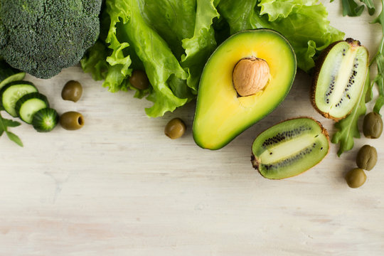 Green Vegetables And Fruits On A Light Background (close-up)