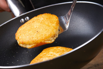 chef making potato pancakes