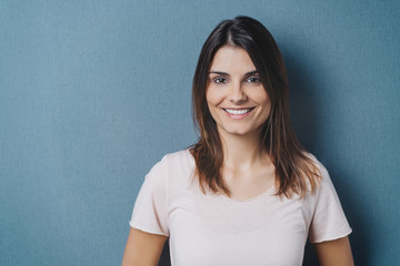 Happy friendly young woman with a beaming smile