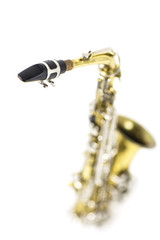 detail of an isolated in white portrait of an alto saxophone / detail of a gold and silver brass saxophone in white background