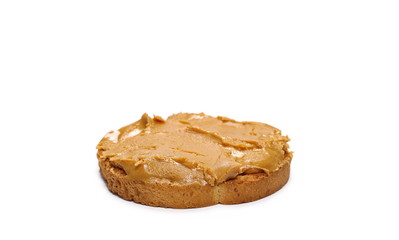 Peanut butter spread on slice of bread isolated on white background