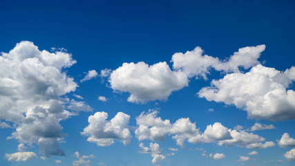 Bright summer blue sky with white clouds.
