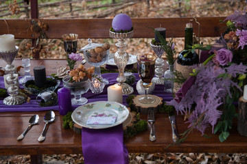 decorated table in the woods