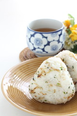 Japanese food, spicy small sardines shirasu in rice ball and tea
