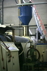 factory shop production of polyethylene film mechanisms machine tools lifting mechanism wires hoses switches pressure gauges pressure temperature molten mass work place enterprise